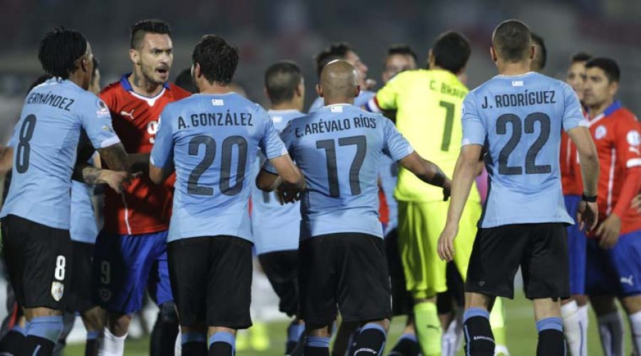Chile 1-Uruguay 0.Chile advance as Uruguayans see Red